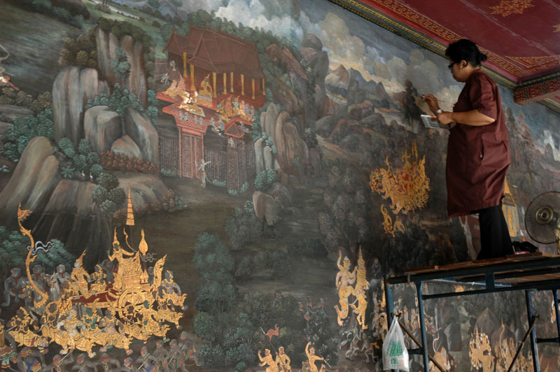 Paintings of Buddhist history and legends surround the entire structure and need constant restoration and maintenance